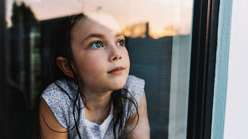A child looking out of a window.-2
