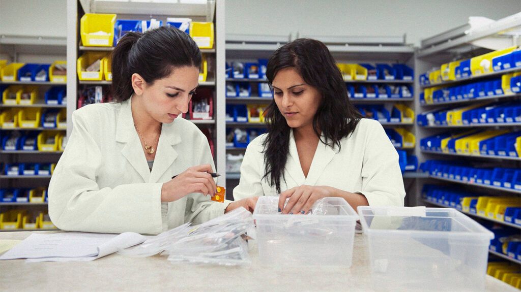Pharmacists check drug prescription