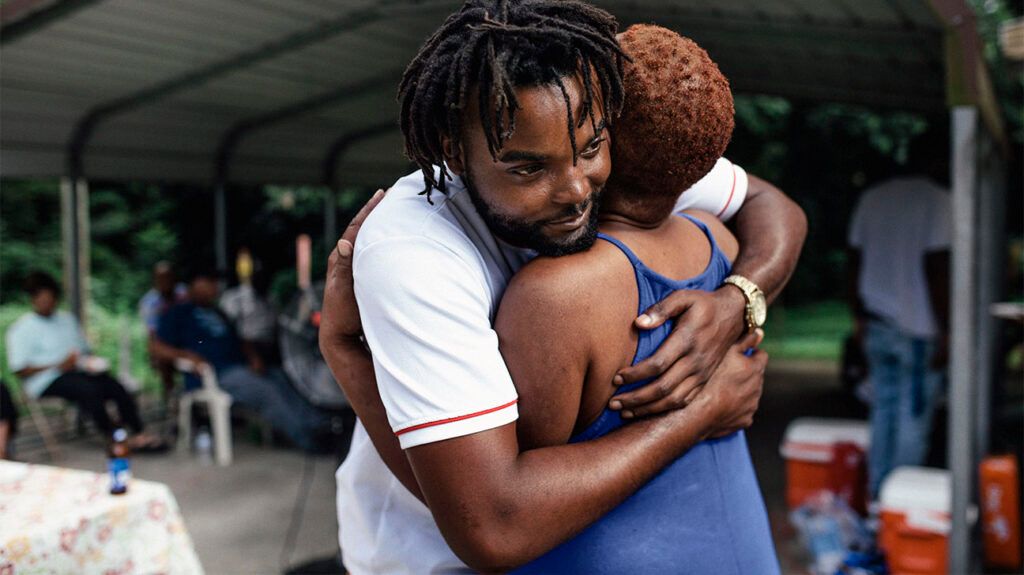 Two people hugging 1