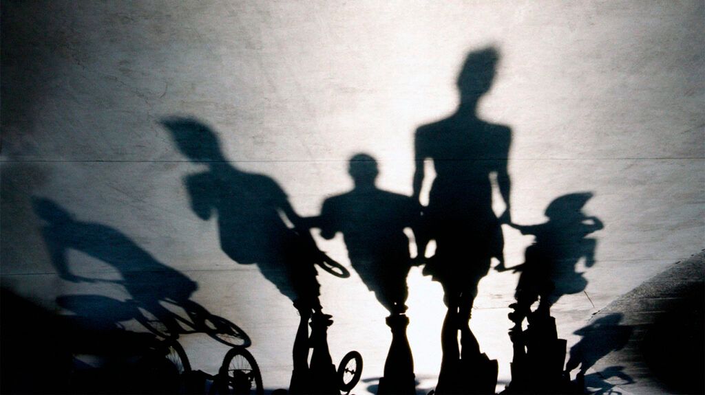 Shadows on a floor from people riding bikes.-2