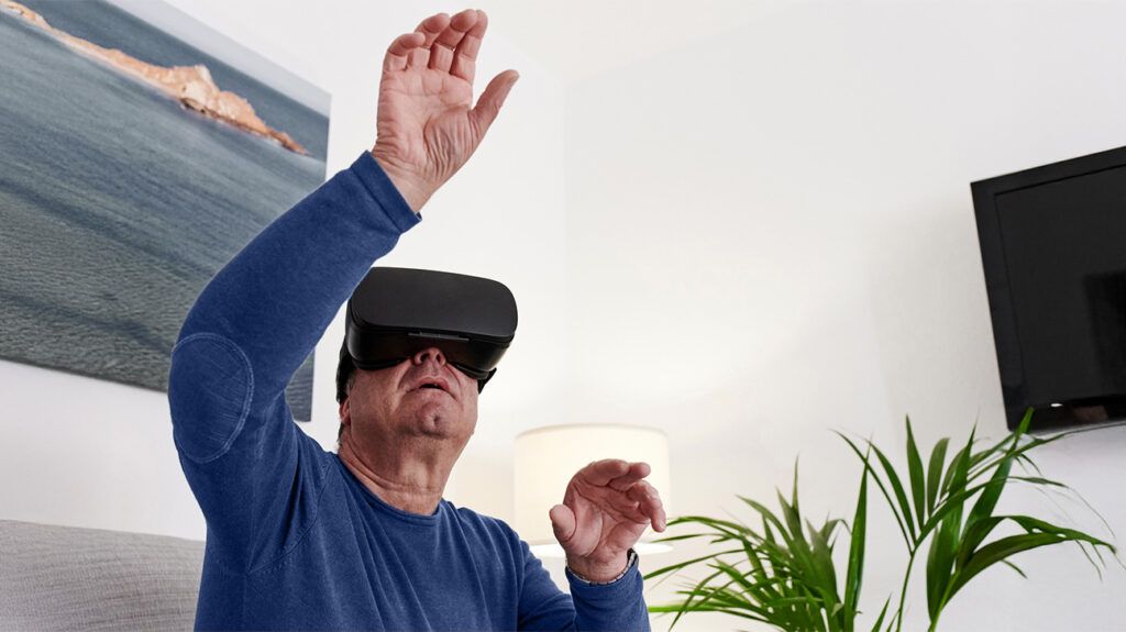 older white man wearing virtual headset