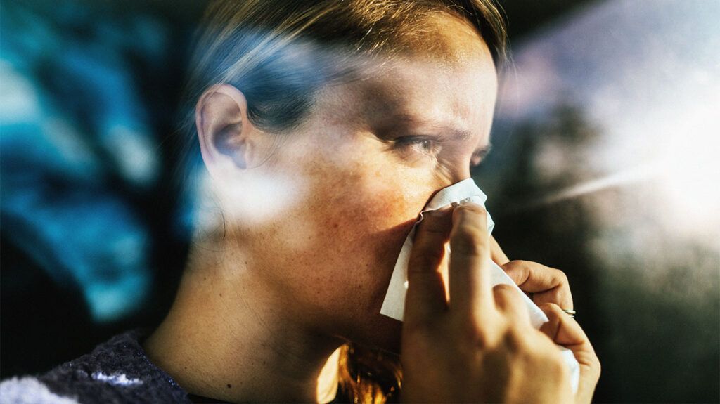 A person blowing their nose 1