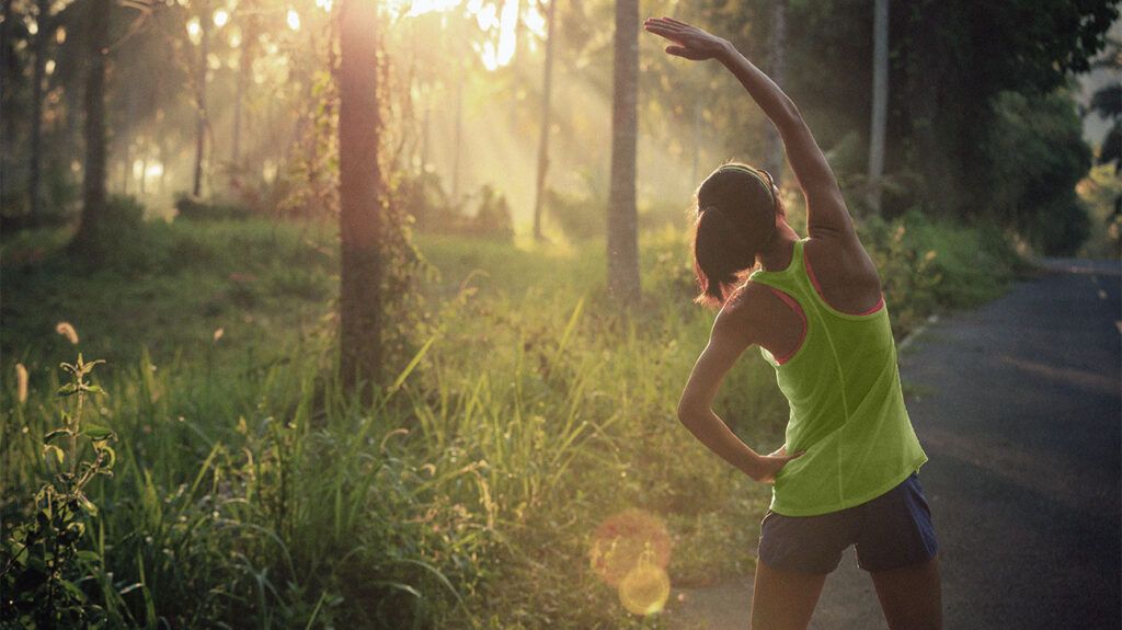 A person stretching in a park 1