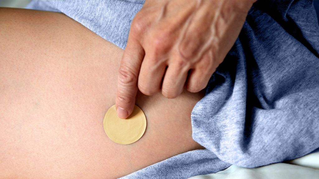 HRT patch on white person's skin
