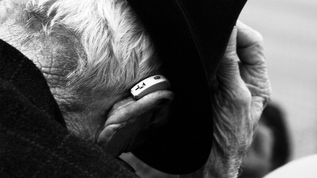 black and white closeup photo of hearing aid