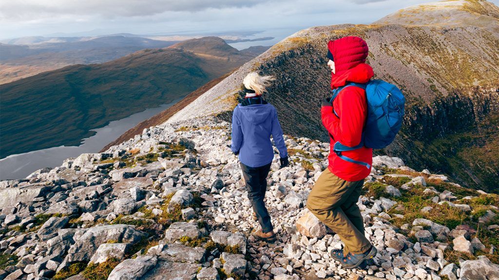 Two people hiking in the mountains.