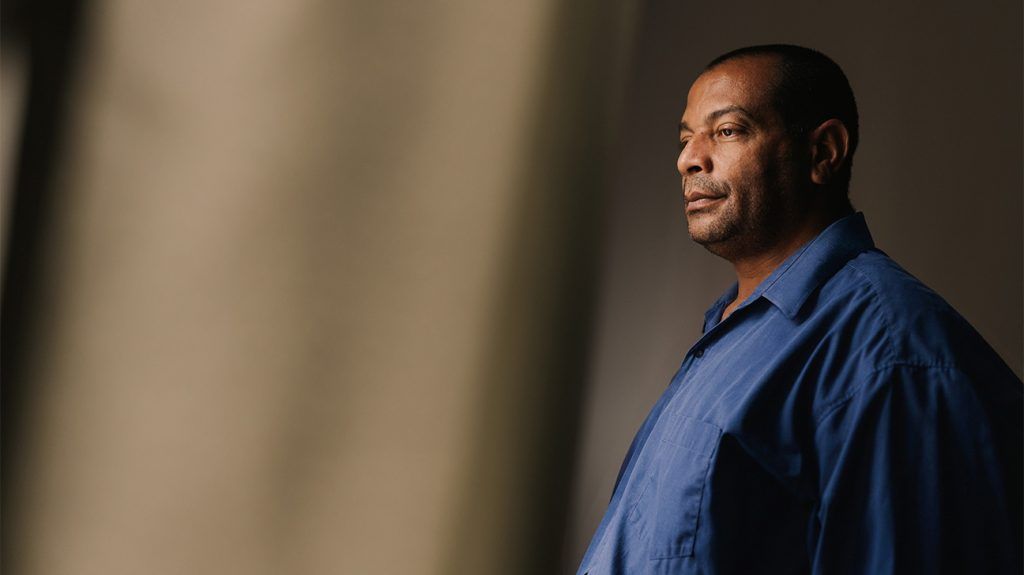 An older adult looking pensive.