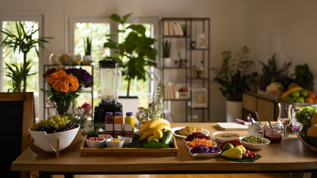 table set with a colorful array of fruits and vegetables