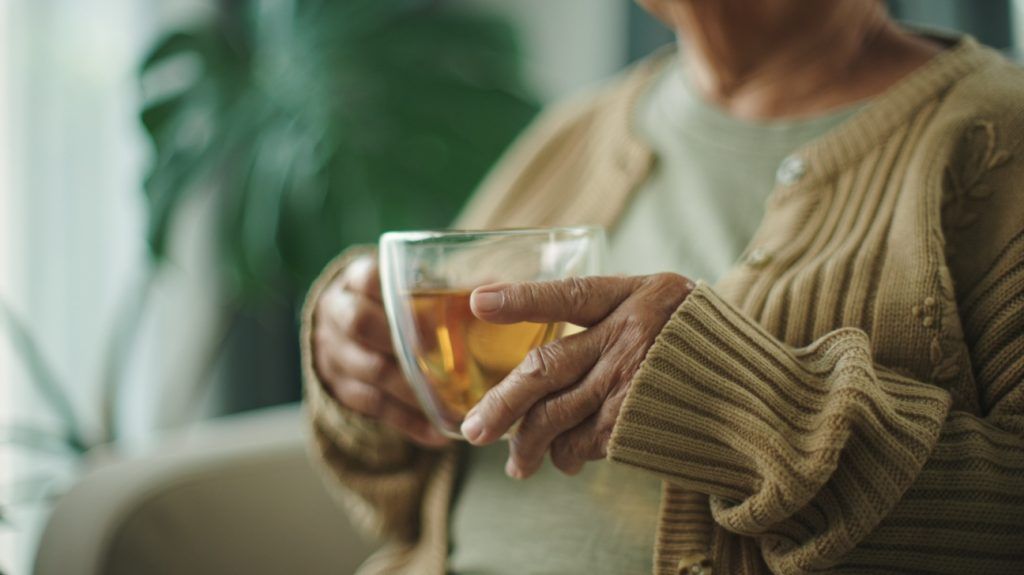 Vascular disease: why 6 to 8 cups of tea a day can reduce your risk 1 Close-up of a person holding a cup of tea.