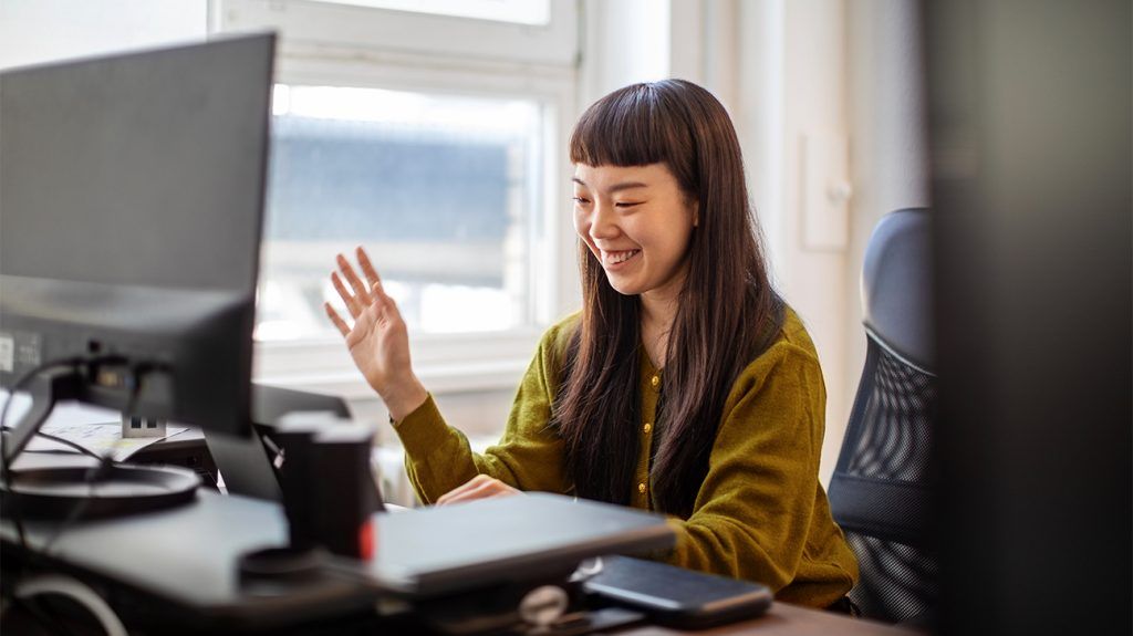 Young woman takes her first online support group session and loves it