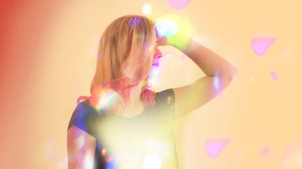 Blond woman with colorful reflections