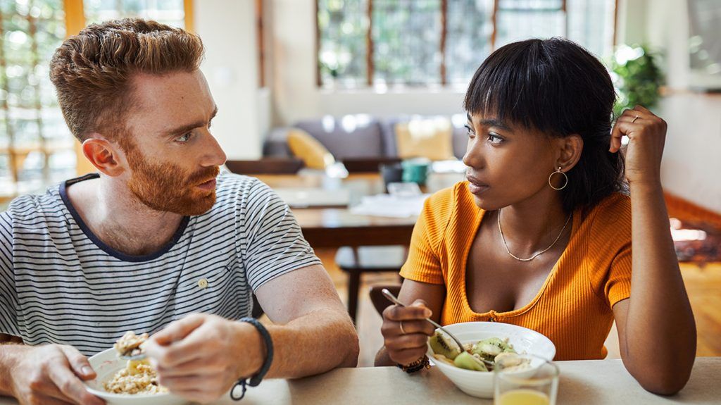 Couple discussing their sex life, over lunch at home
