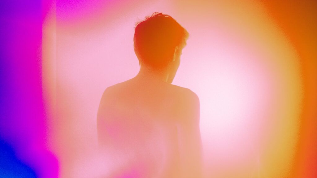 Man from behind with a colorful aura