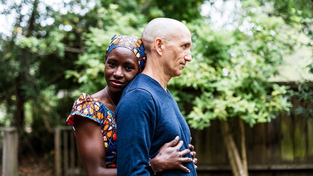 Woman hugging man