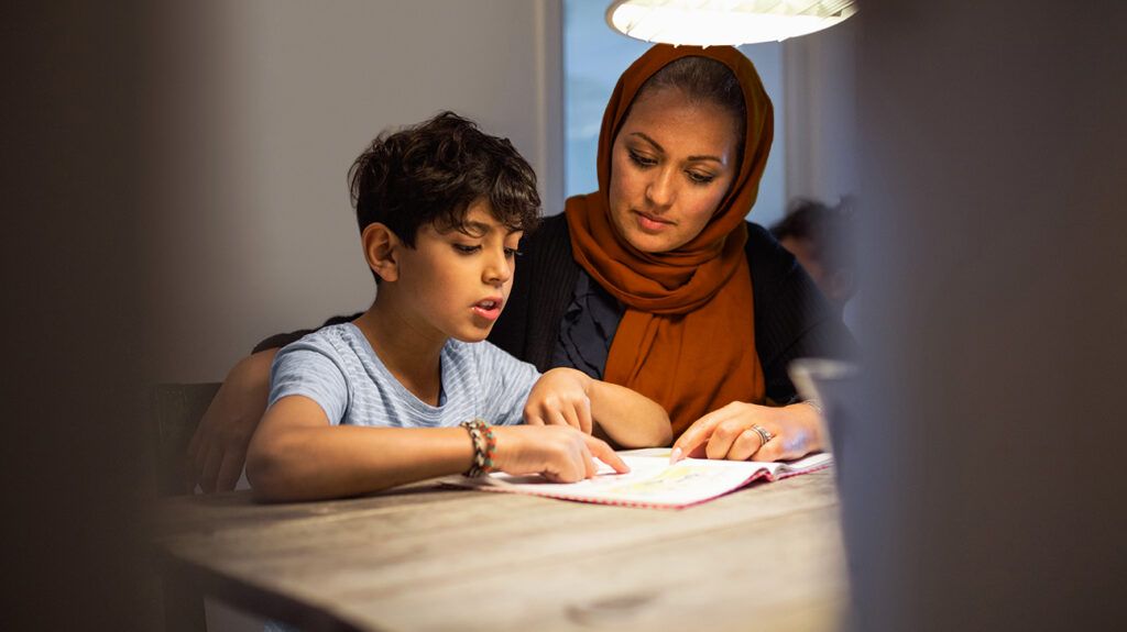 Mother and son with ADHD/dyslexia reading book