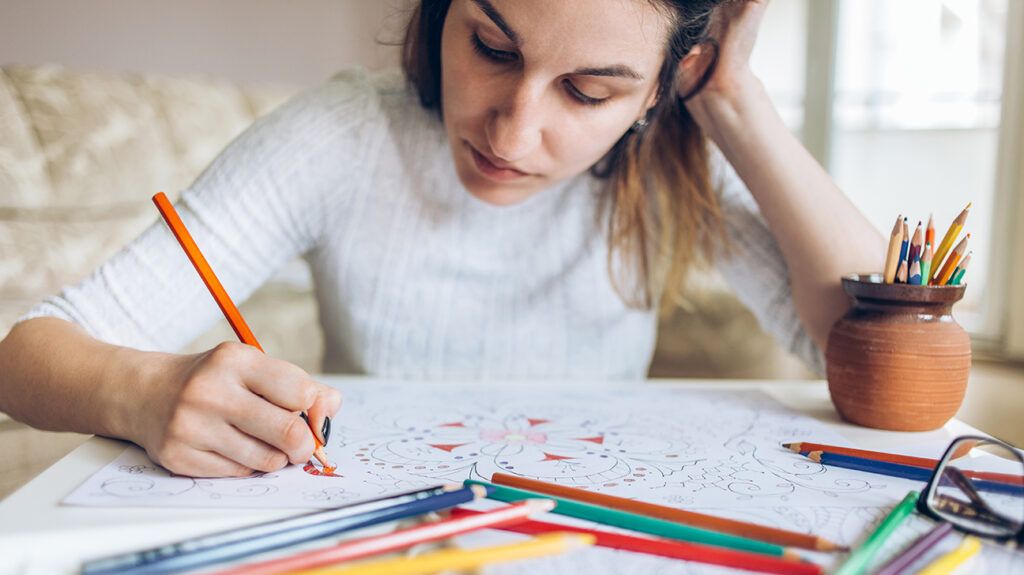 Woman coloring for anxiety relief