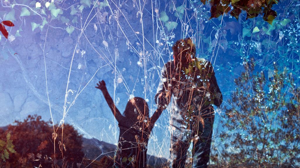 Father and daughter selfie in window