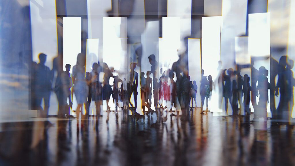 A group of people seen as reflections in multiple mirrors