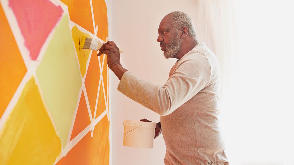 Man painting as a healthy way to express himself