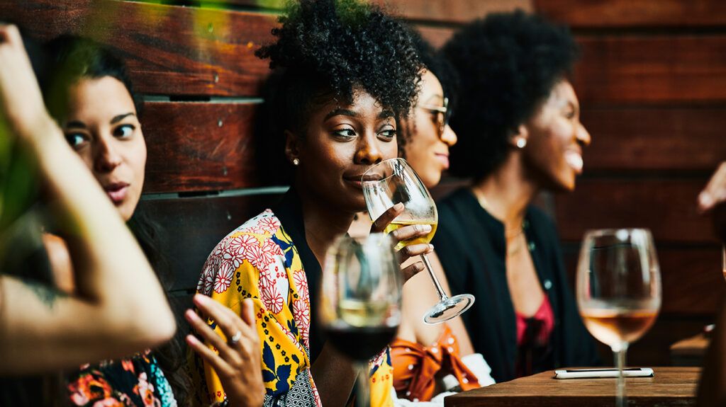 Woman side-eyeing her friend, realizing she's jealous