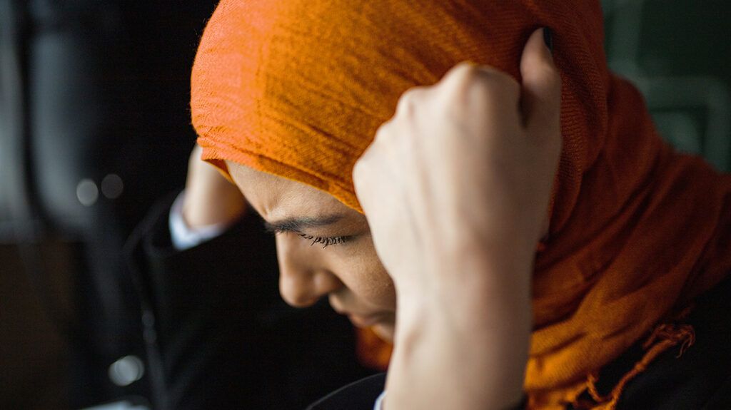 Woman in hijab with headache