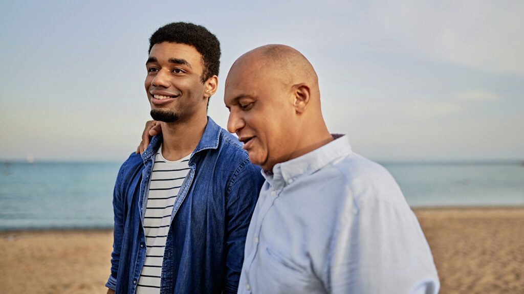 Young man walks with his parent who has bipolar disorder