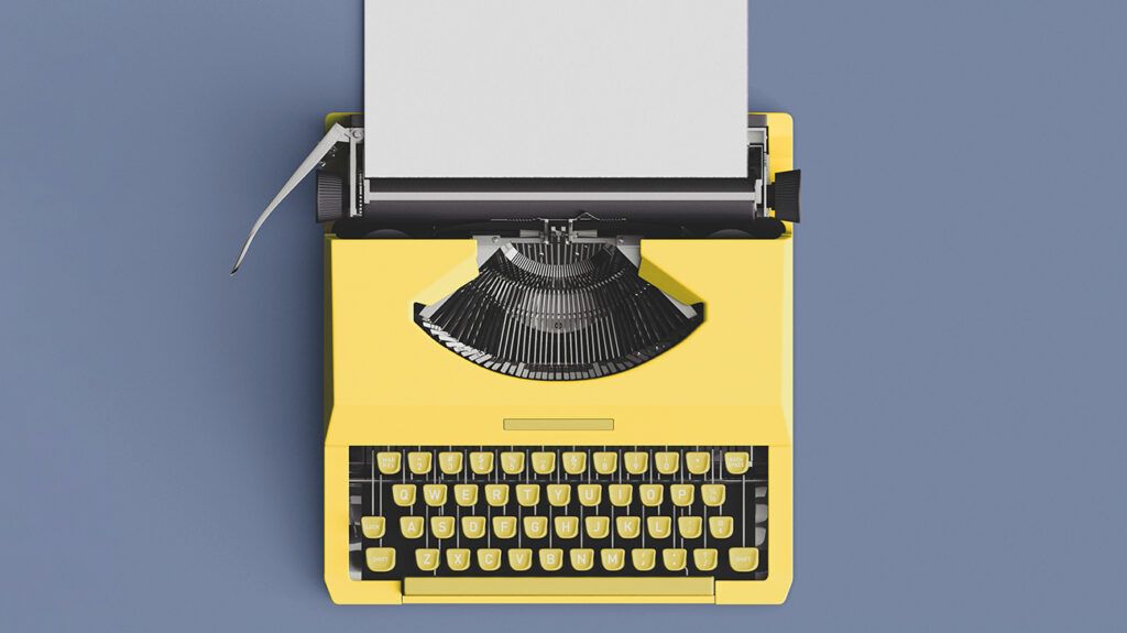 Top view of yellow typewriter with blank page on blue background
