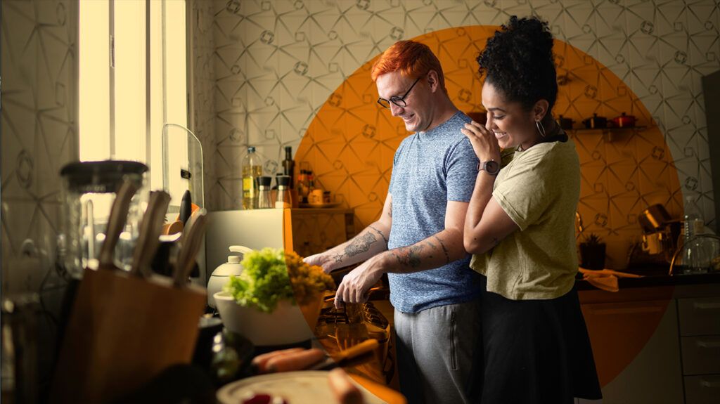 A couple preparing a meal in a kitchen together