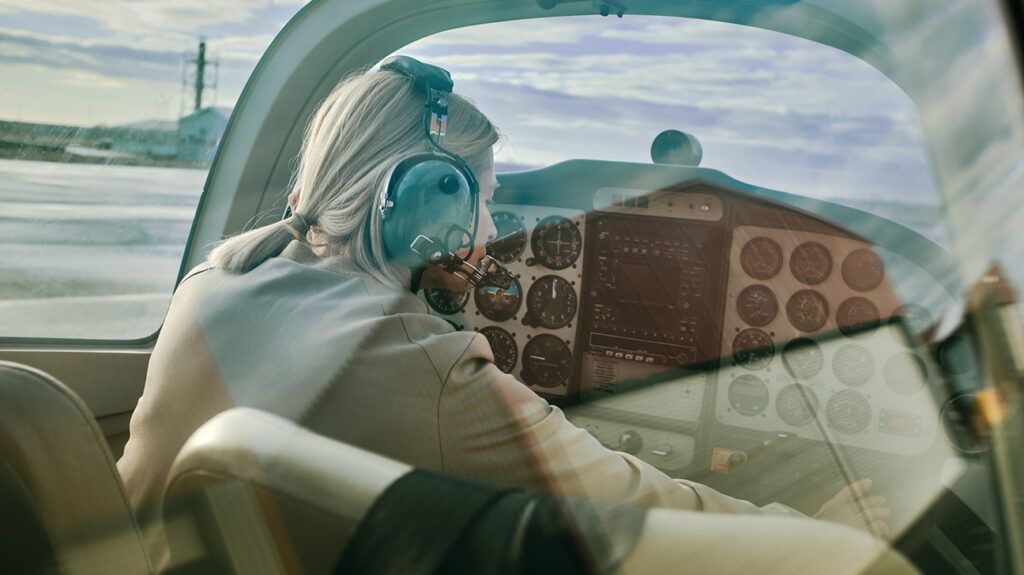 Female aviator pilot in a cockpit