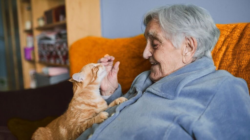 Older woman with her emotional support cat to help with ptsd symptoms
