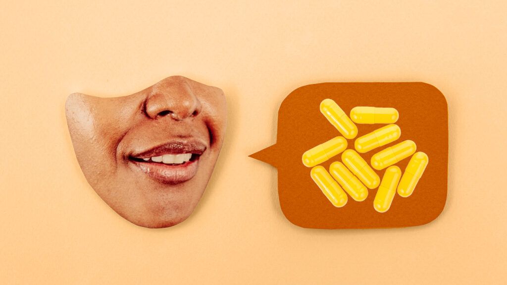 Paper cutout of a face and a speech bubble with antidepressants in it on a light orange background