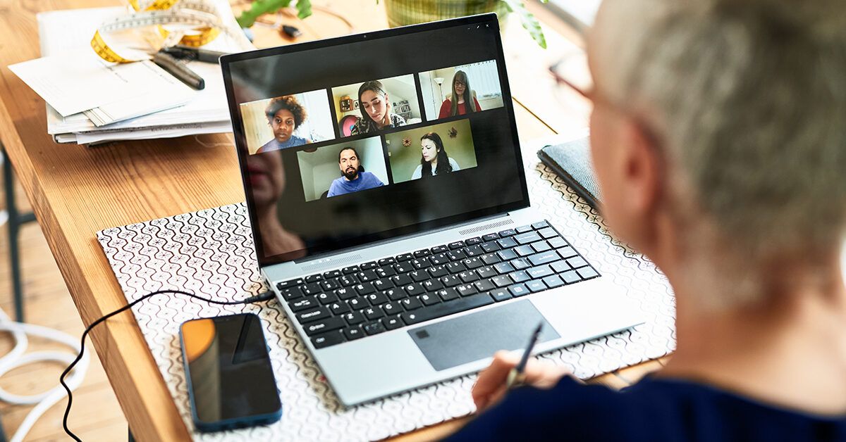 Friends online video conference by computer. Young people chat with each  other virtually in video call