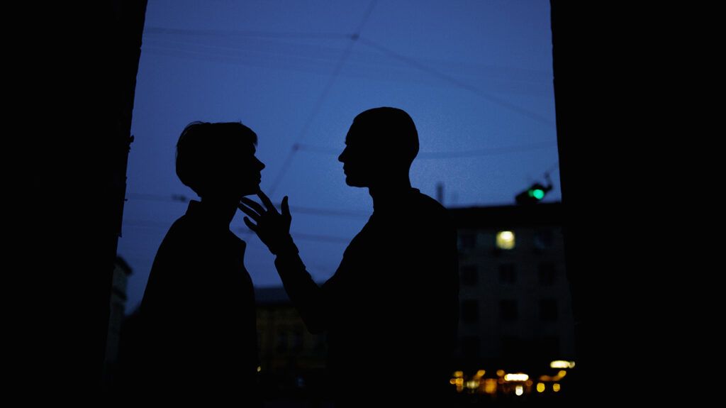 Silhouette of couple at night