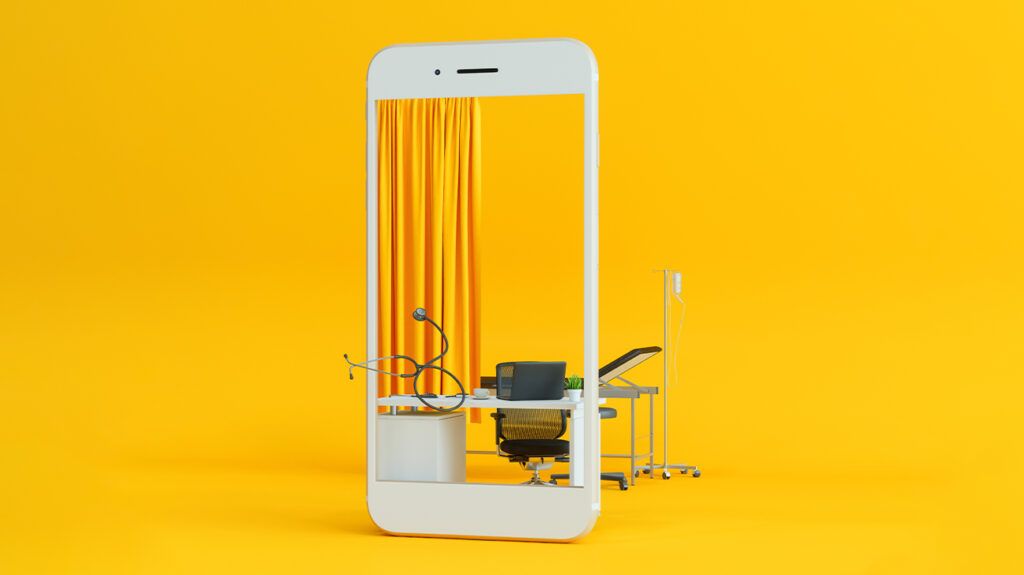 Oversized smartphone model used as a frame for a doctor's office with desk, examination bench, yellow curtain; background is yellow