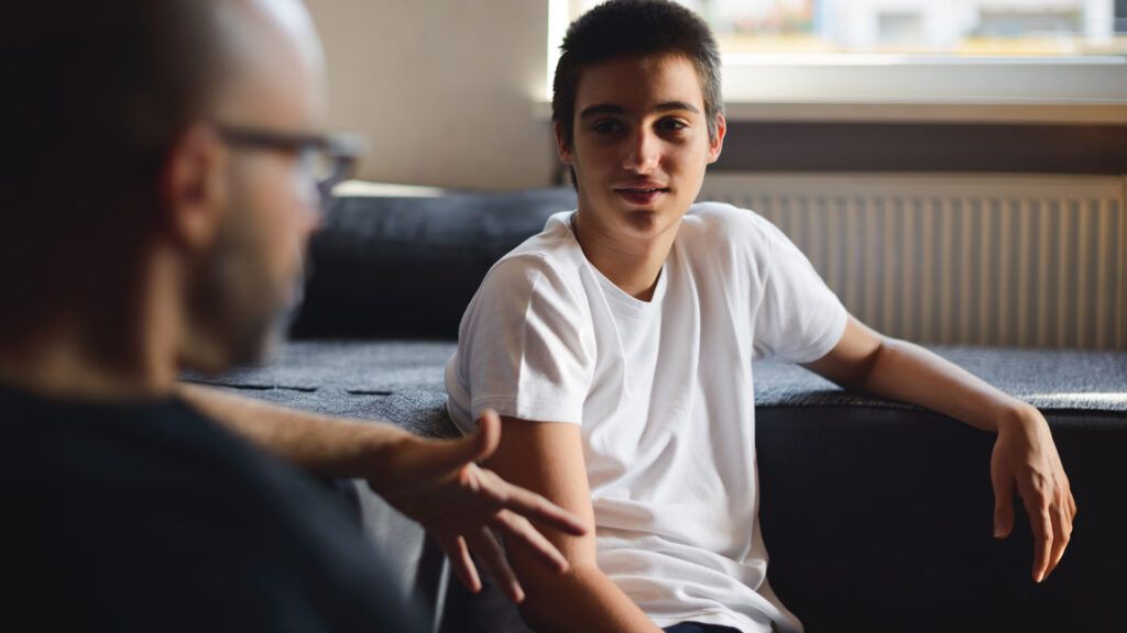 Father talking to son, whom he suspects has depression
