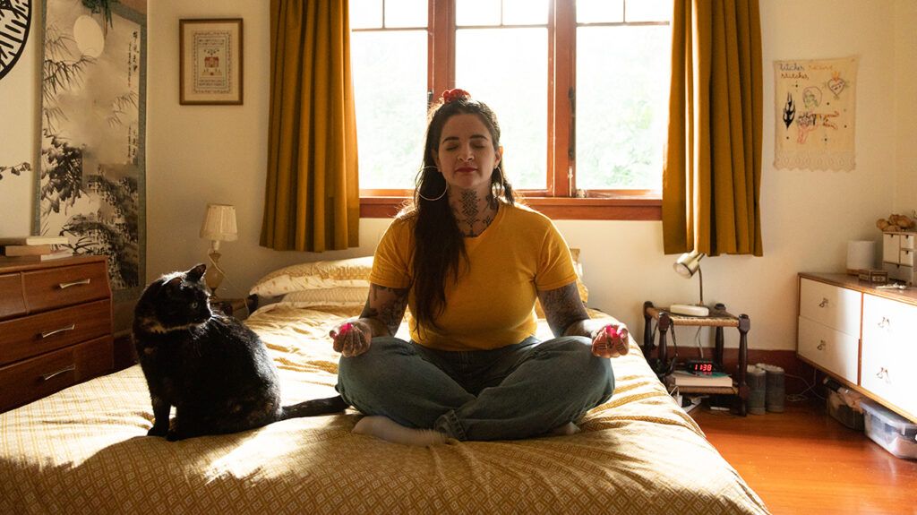 Woman practicing meditation indoors, for her ADHD