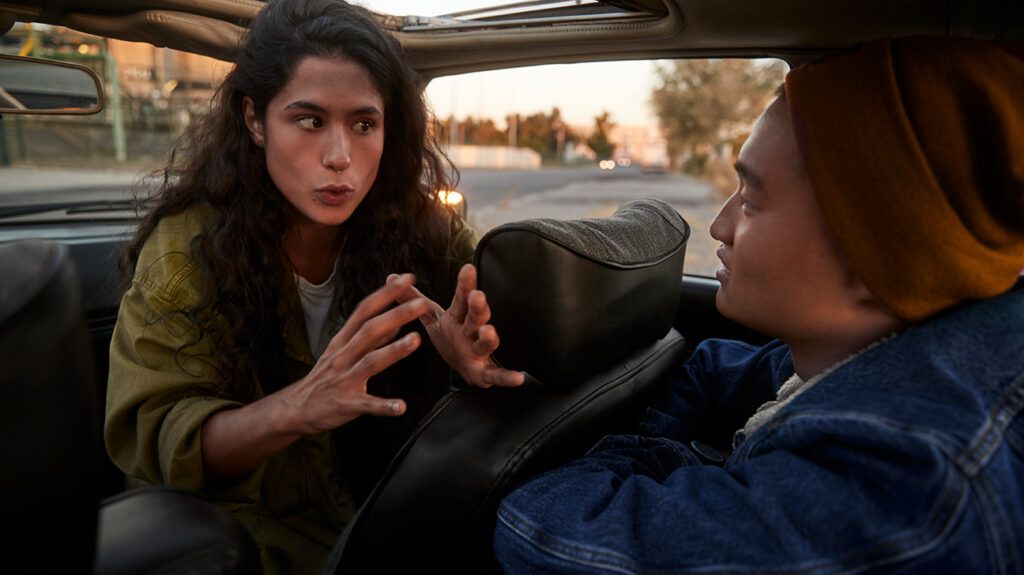 Young couple arguing in car