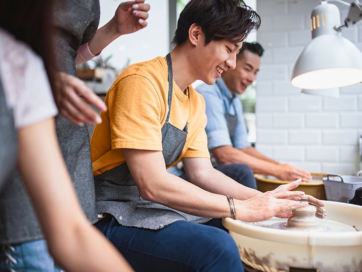 'a group of people in a pottery workshop'