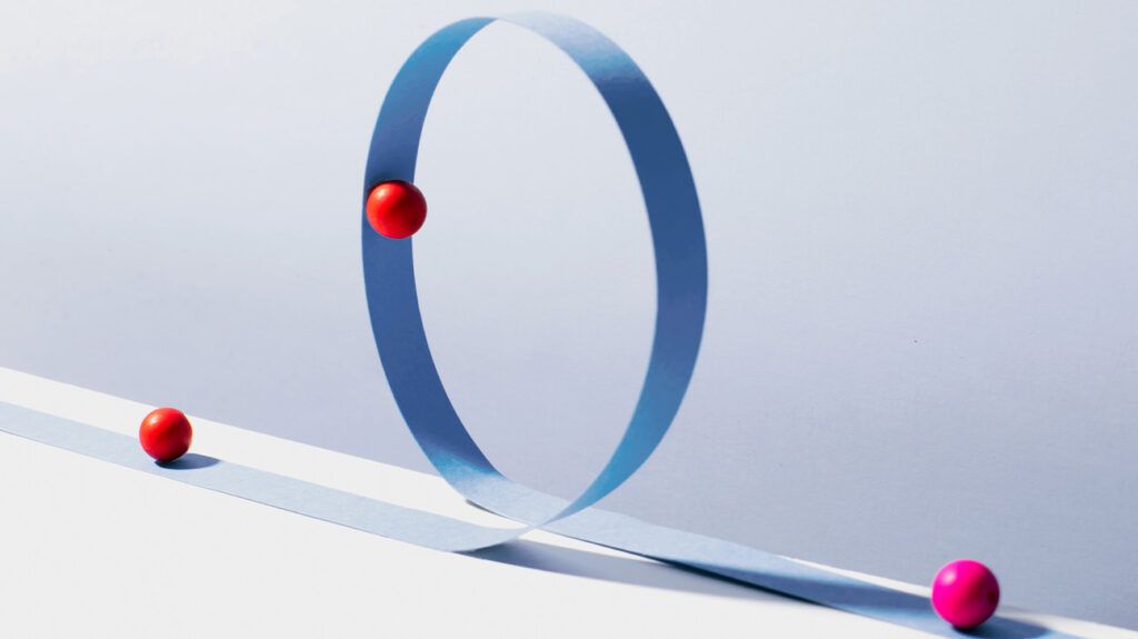 red balls tracking on a blue loop, symbolic of hypersensitivity in ADHD or SPD