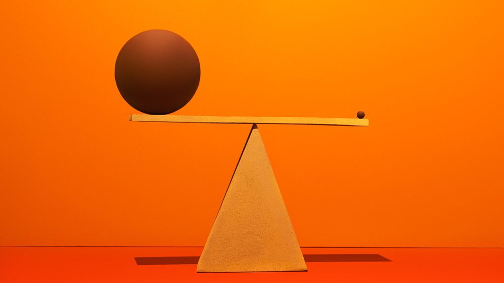 One large and one small circle balancing on a scale in front of an orange background