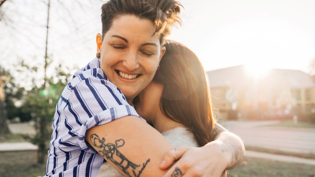 Two women hugging