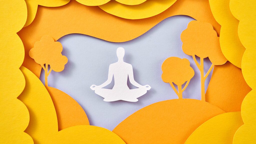 paper craft illustration of person relaxing in meditation pose