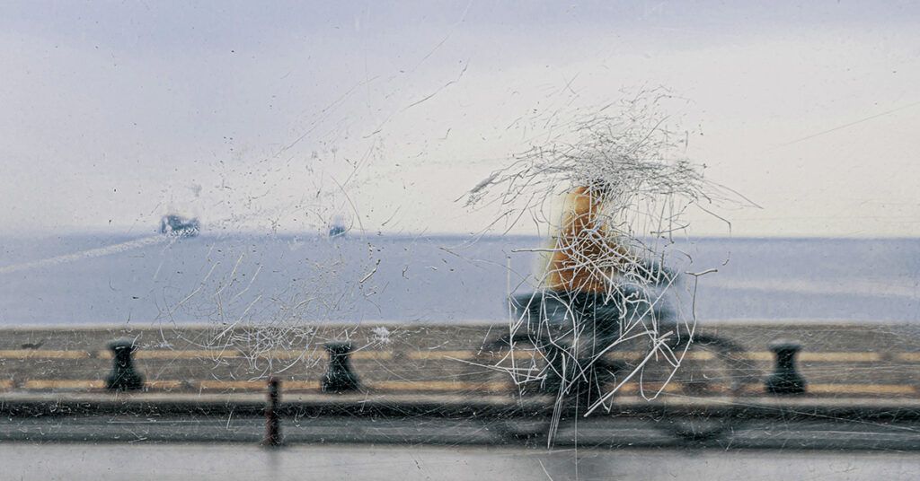 Photo of person with bipolar disorder riding a bike the face is scratched out symbolizing a migraine