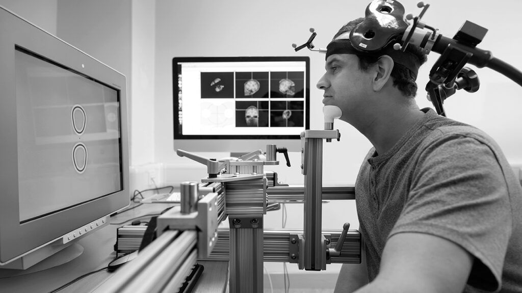 a man receiving a transcranial magnetic stimulation procedure