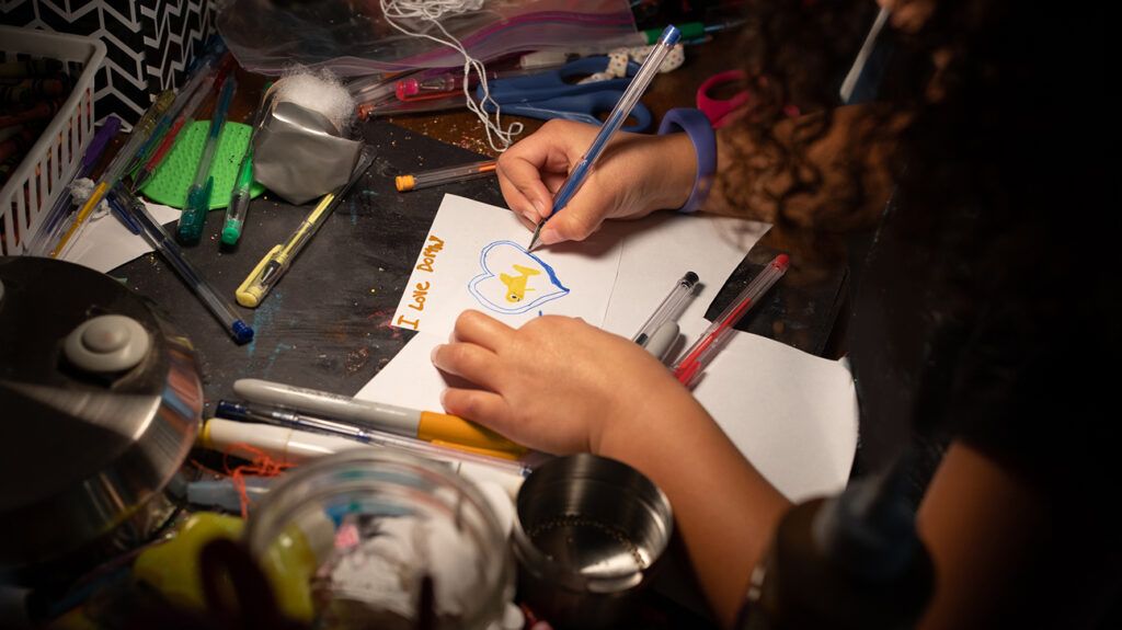 Child memorializing pet fish that died in a drawing