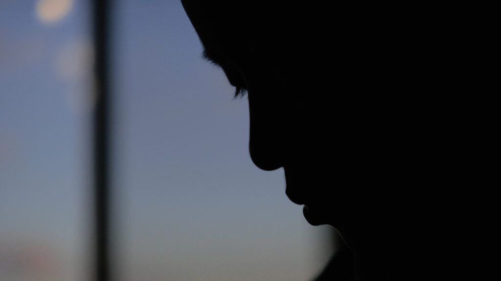 a close up silhouette of a person's face