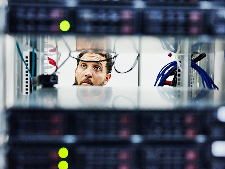'a man looking at a computer'