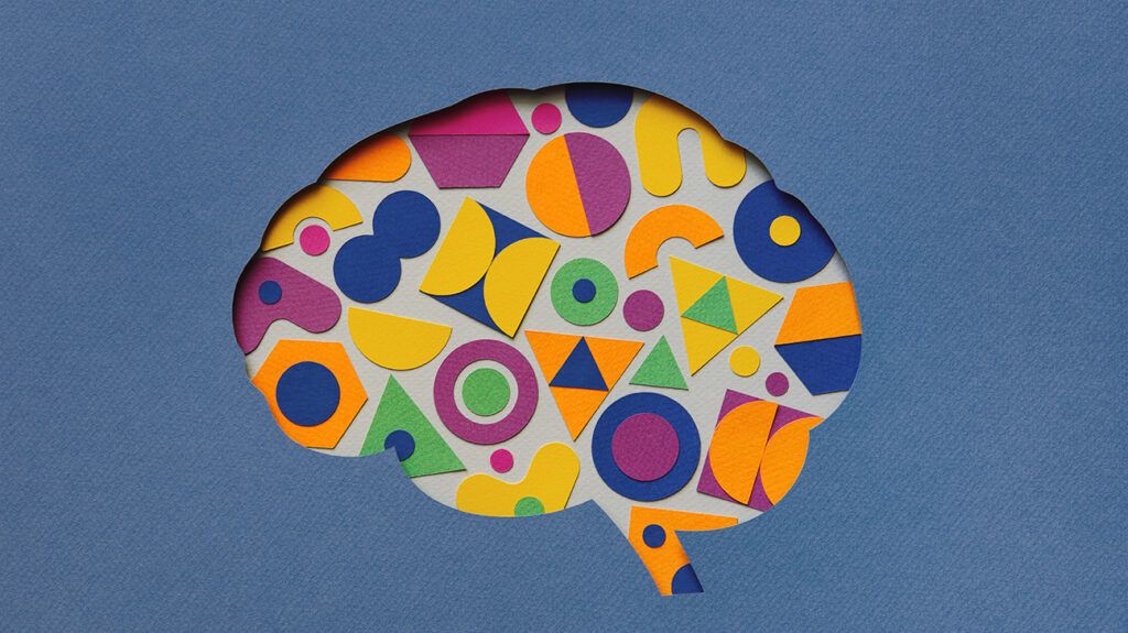 Multicolored gears inside a brain, symbolic of neurodivergence
