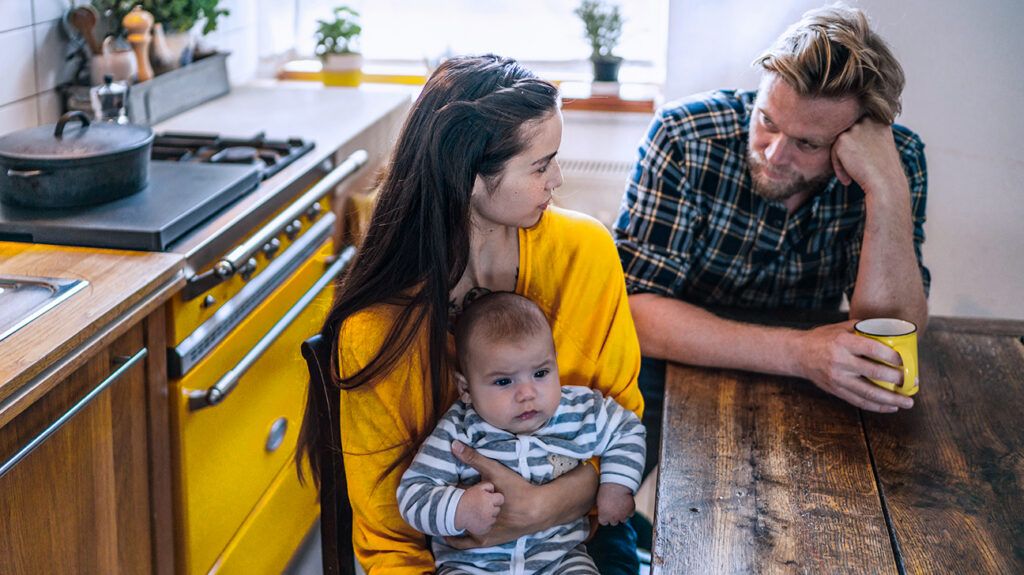 Mother with baby and father feeling jealous 