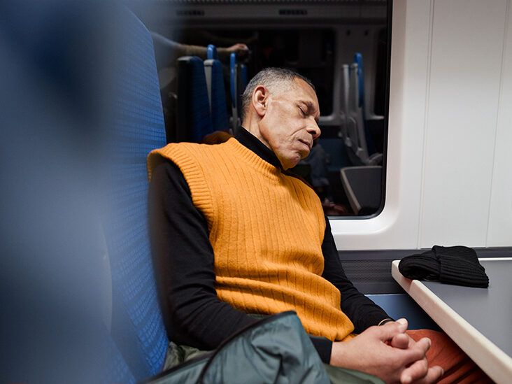 https://media.post.rvohealth.io/wp-content/uploads/sites/4/2022/07/senior-man-sleeping-on-train-public-transportation-732x549-thumbnail-732x549.jpg